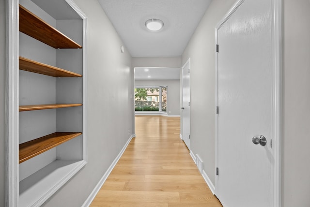 hallway featuring light hardwood / wood-style floors