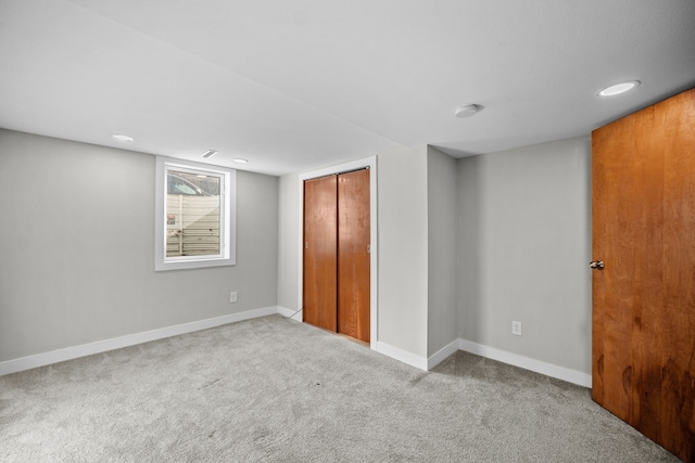 unfurnished bedroom featuring a closet and carpet