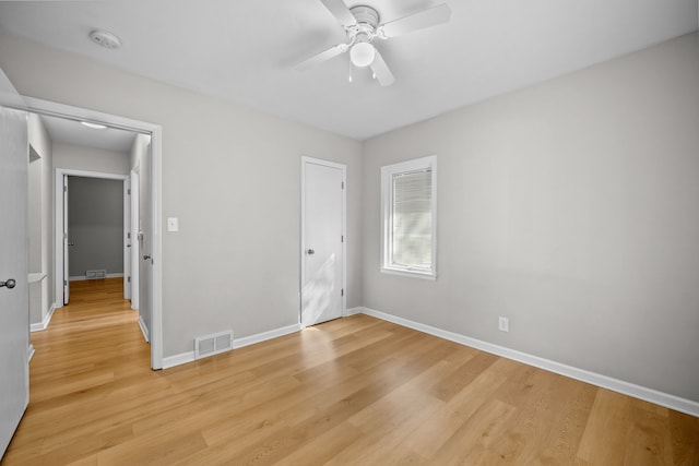 unfurnished bedroom with ceiling fan and light hardwood / wood-style flooring