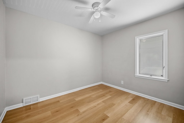 empty room featuring light hardwood / wood-style flooring and ceiling fan