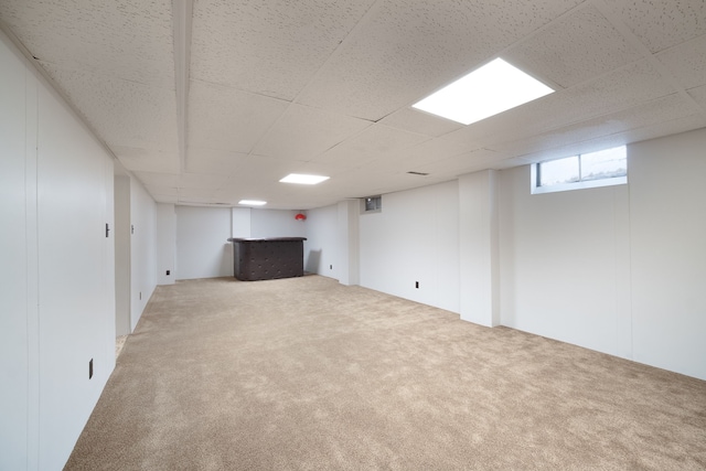 basement featuring carpet flooring