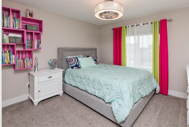 bedroom with baseboards and carpet floors