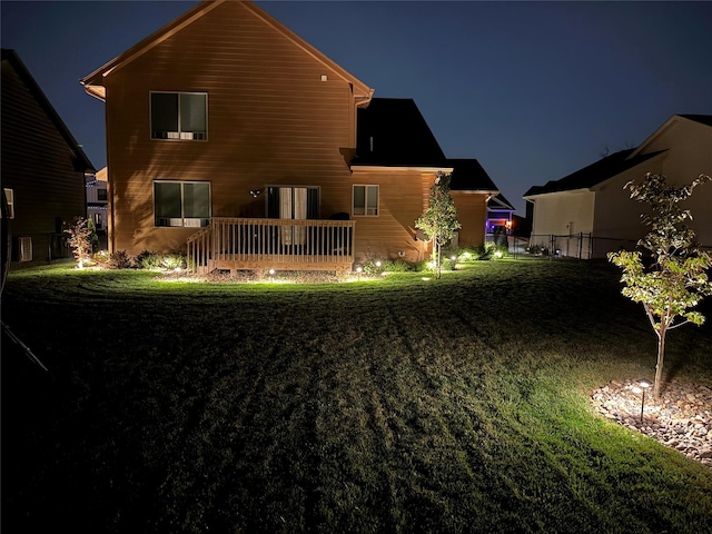 view of back of house at twilight