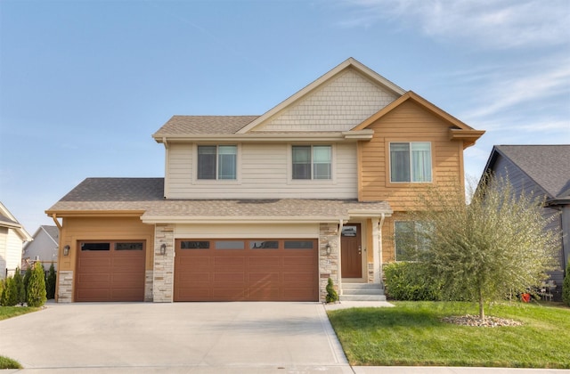 craftsman-style home featuring stone siding, concrete driveway, a front lawn, and a shingled roof