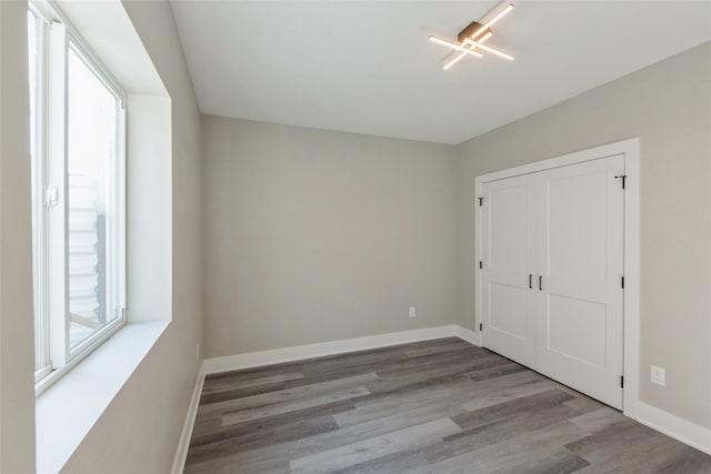 unfurnished bedroom featuring a closet and light hardwood / wood-style floors