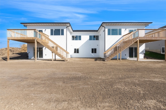 back of house featuring a deck