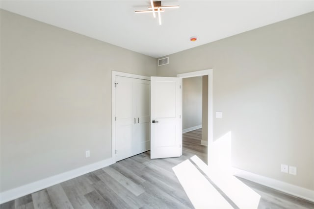 unfurnished bedroom with light hardwood / wood-style flooring