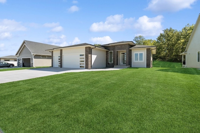 view of front of home with a front yard and a garage