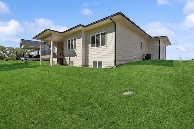 view of home's exterior featuring a lawn and central air condition unit