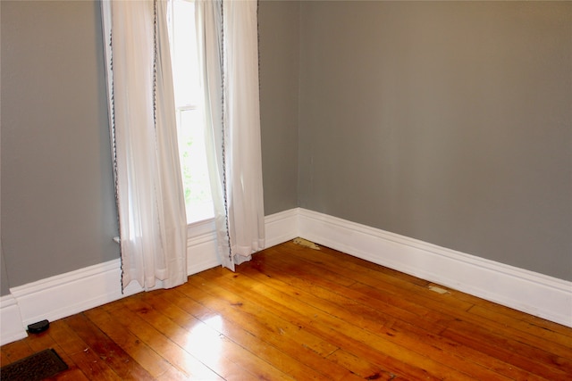 empty room featuring hardwood / wood-style floors