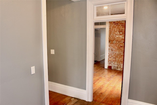 1510 9th St, Des Moines, IA 50314 - hallway featuring hardwood / wood-style floors and baseboards