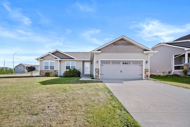 view of front of property with a front yard and a garage