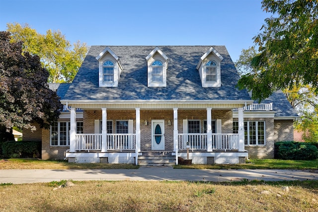 cape cod-style house with a porch