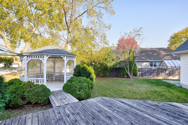 deck with a gazebo and a lawn