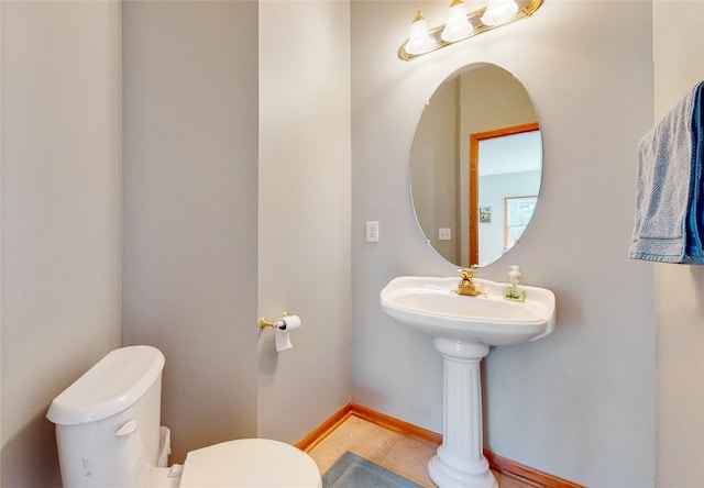 bathroom with tile patterned floors and toilet