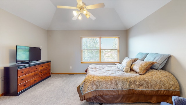 carpeted bedroom with vaulted ceiling and ceiling fan