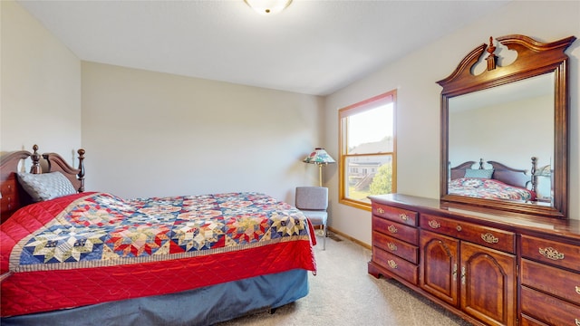 bedroom with light colored carpet