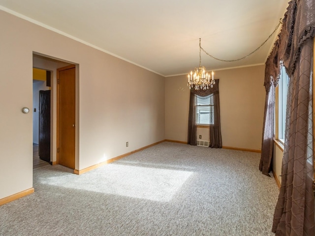 empty room with carpet, ornamental molding, a wealth of natural light, and a notable chandelier