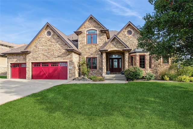 view of front of house featuring a front yard and a garage