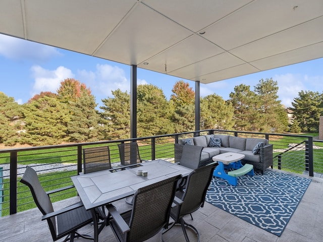 exterior space with outdoor lounge area and a balcony