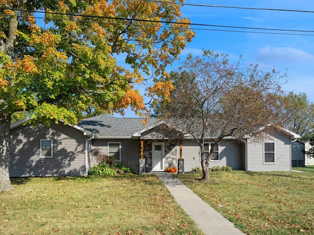 ranch-style house featuring a front lawn