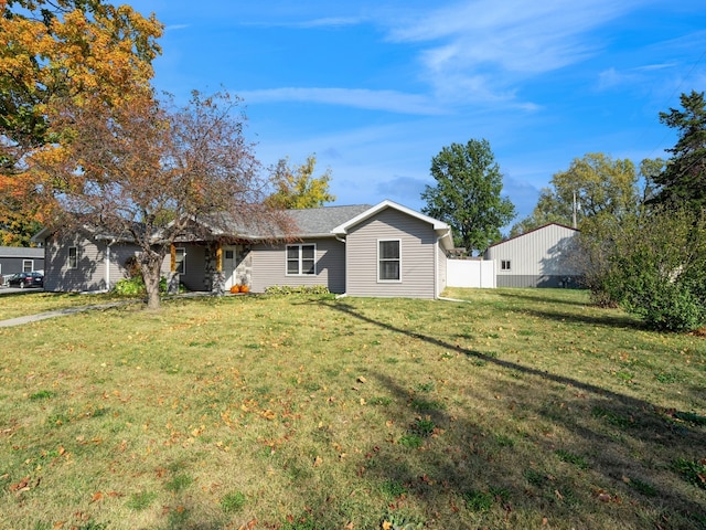 back of property with a lawn