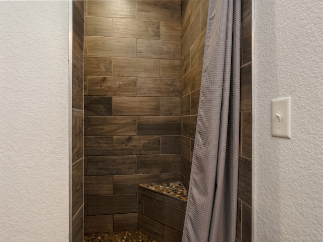 bathroom featuring a shower with curtain