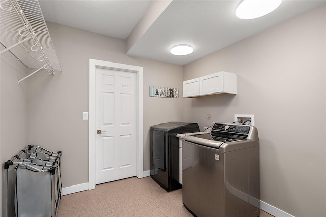 laundry room with washing machine and dryer