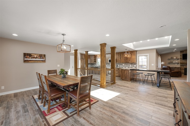 dining room featuring light hardwood / wood-style floors and an inviting chandelier