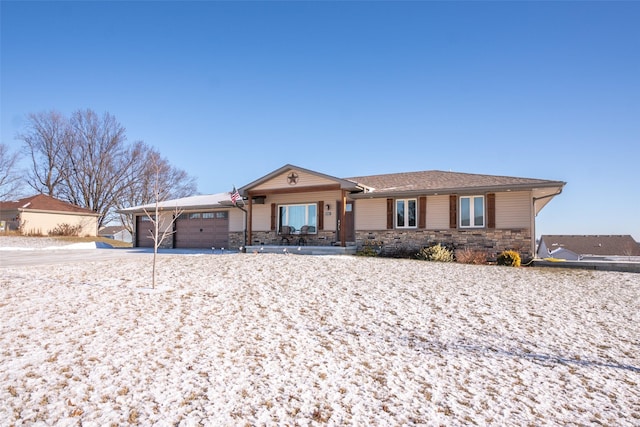 ranch-style house featuring a garage