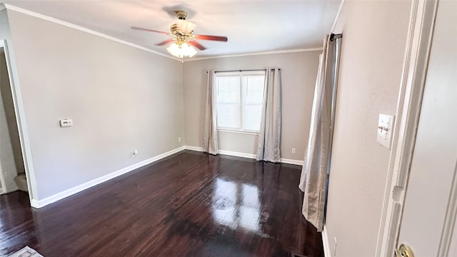 empty room with ceiling fan, dark hardwood / wood-style flooring, and ornamental molding