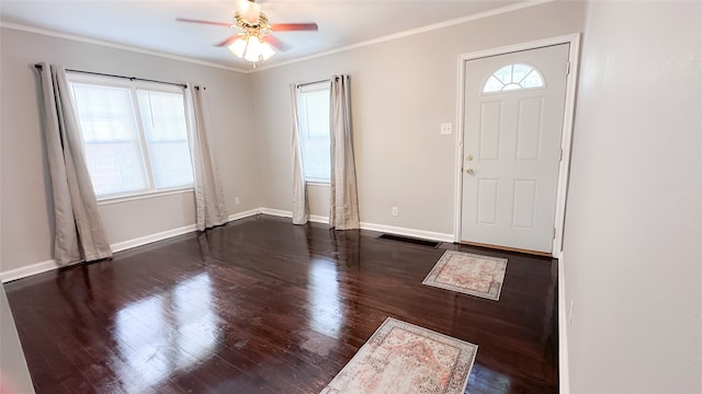 foyer featuring dark hardwood / wood-style floors, ceiling fan, and ornamental molding