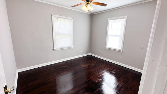 empty room featuring hardwood / wood-style floors, ceiling fan, and crown molding