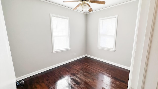 spare room with a wealth of natural light, hardwood / wood-style floors, ceiling fan, and crown molding