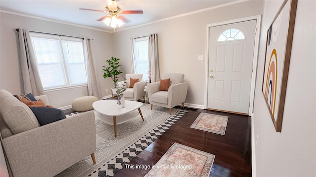 living room featuring dark hardwood / wood-style flooring, a wealth of natural light, and ornamental molding