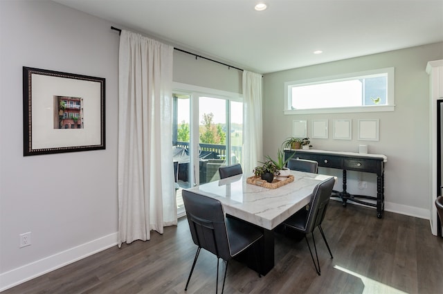 dining area featuring dark hardwood / wood-style flooring