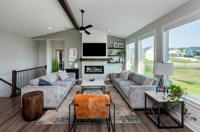 living room featuring ceiling fan, lofted ceiling with beams, and dark hardwood / wood-style flooring