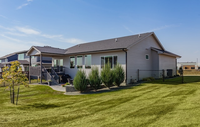 back of house featuring a yard and a patio