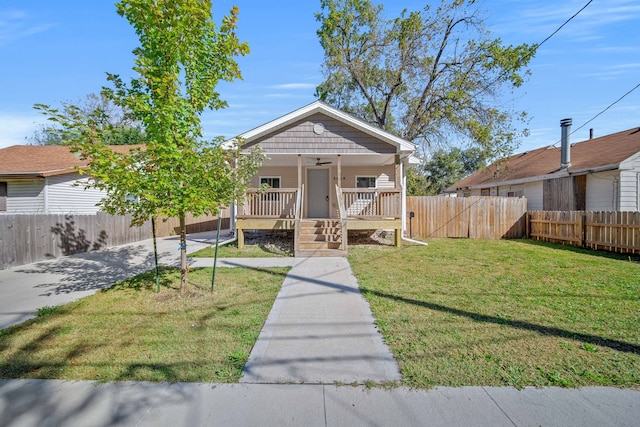 bungalow-style house with a front lawn and a porch