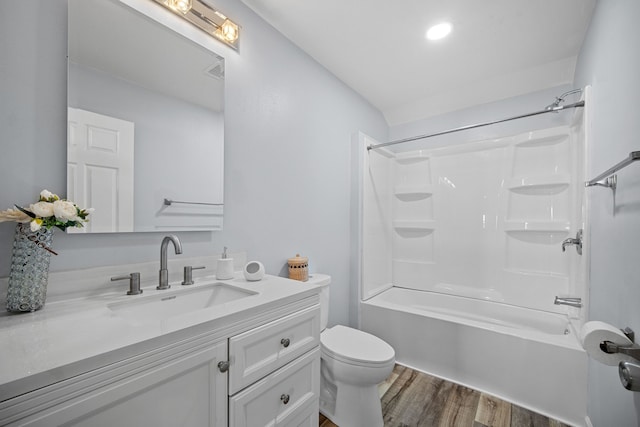 full bathroom with wood-type flooring, shower / bathtub combination, vanity, and toilet