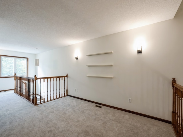 basement with a textured ceiling and carpet