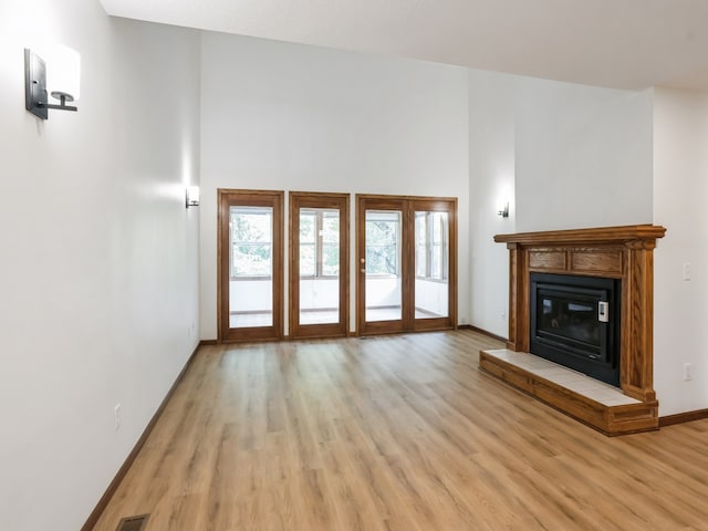 unfurnished living room featuring light wood-type flooring