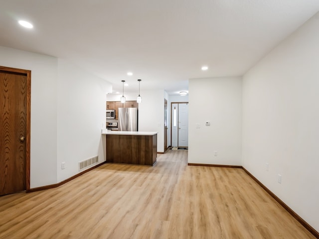 unfurnished living room featuring light wood-type flooring