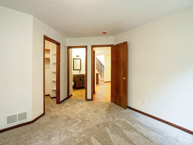 empty room featuring light carpet