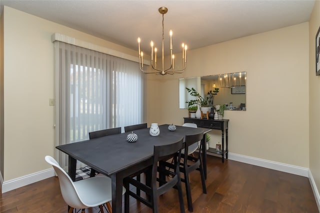 dining area with an inviting chandelier and dark hardwood / wood-style flooring