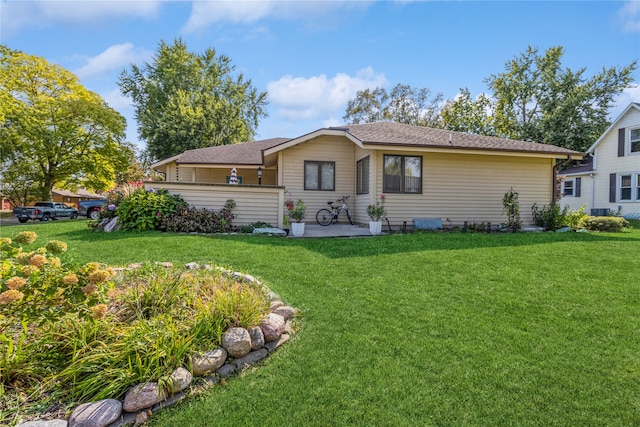 ranch-style house with a front lawn