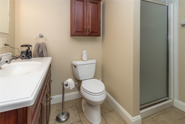 bathroom with vanity, a shower with shower door, toilet, and tile patterned flooring