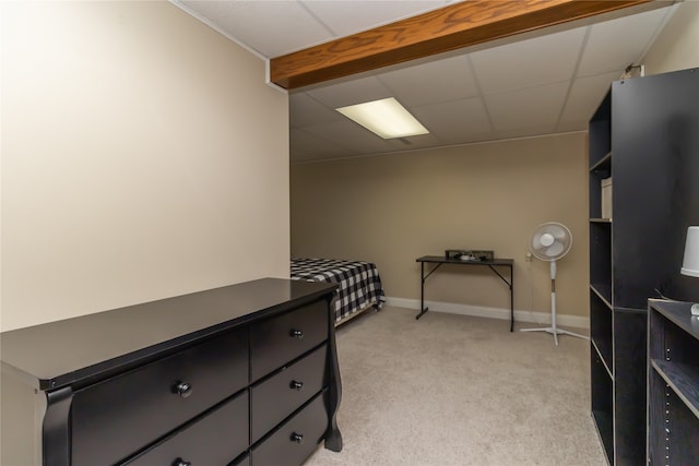 carpeted bedroom featuring a paneled ceiling