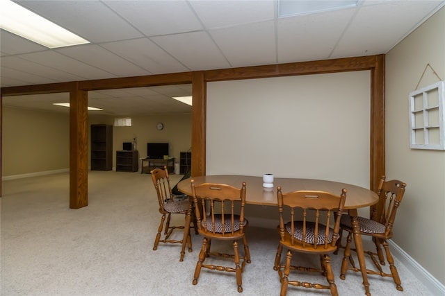 dining room featuring a paneled ceiling and carpet floors