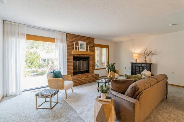 living room with a textured ceiling, a fireplace, and light carpet